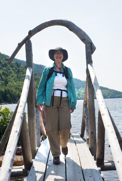 JordanPondBridgeMary_4541.jpg - Mary crossing footbridge, north end of Jordan Pond