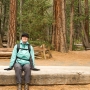 Mary resting on a huge slab of Douglas Fir on the Lower Yosemite Fall Trail